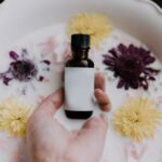 woman holding essential oil